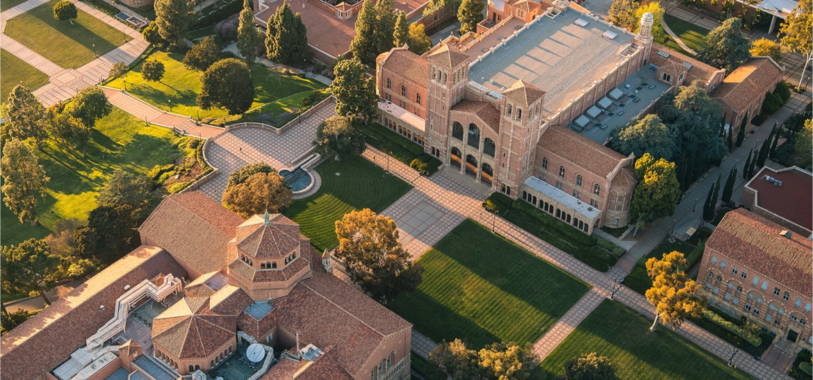 Aerial view of Royce Hall and Powell Library in sunset