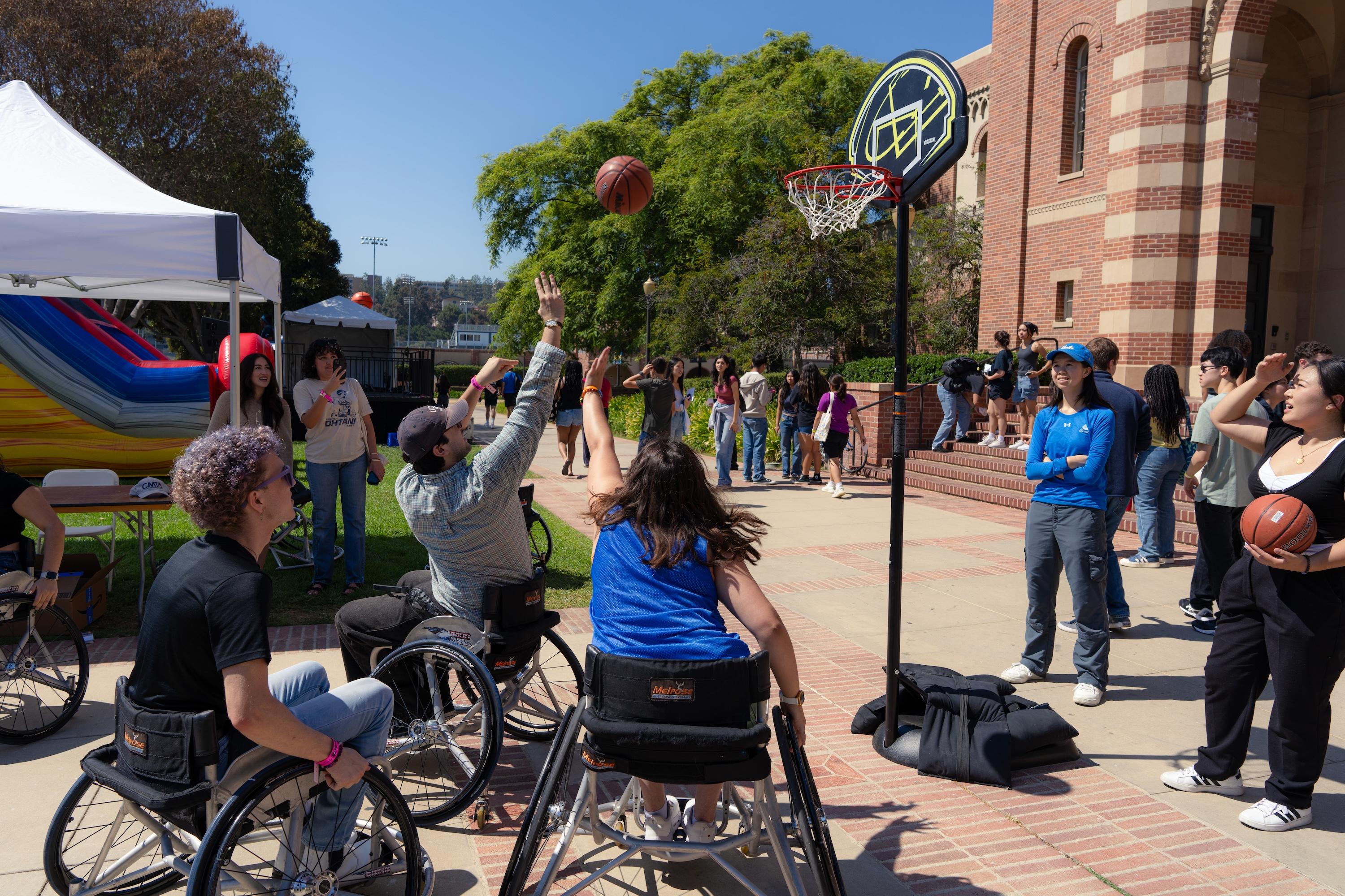 Students in wheelchairs playing basketball.